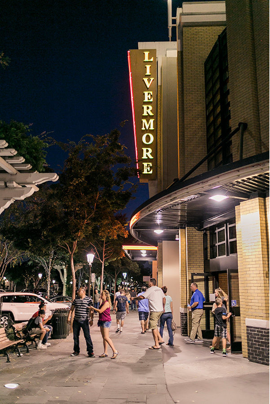 The glowing Livermore sign over the downtown theater at night
